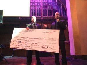 Junior Achievement of Central Ohio President, Mike Davis, graciously accepting a check of $45,000.